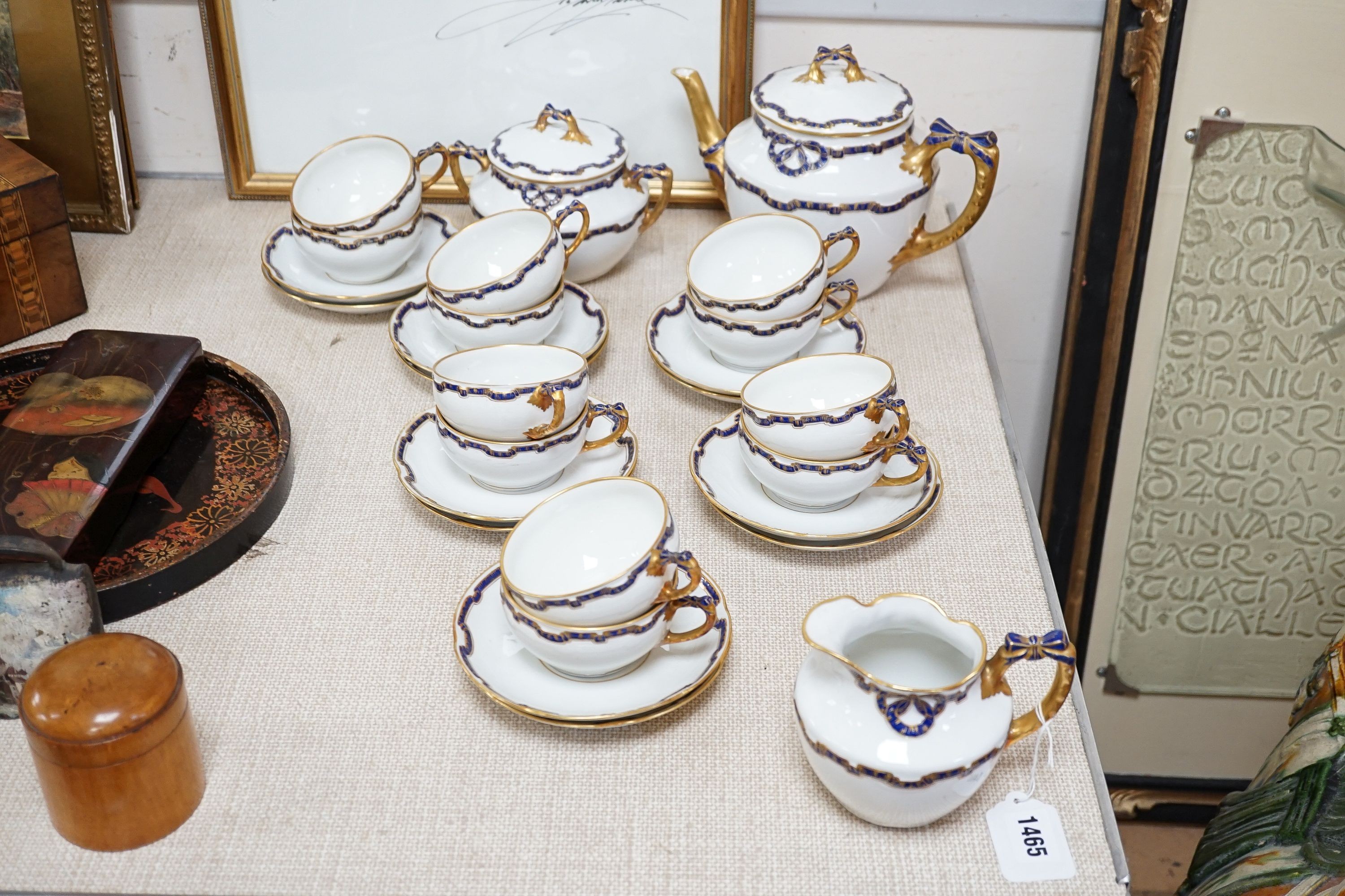 An early 20th century Richard Ginori gilt and blue ribbon decorated tea set